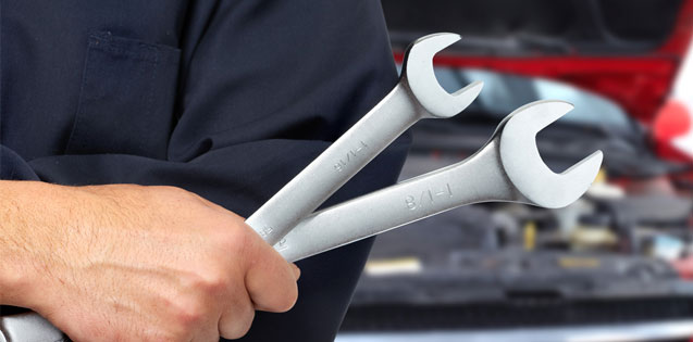 Man Holding Spanners